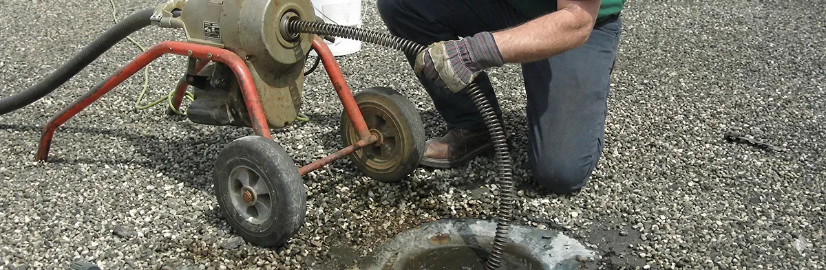 sewer rodding technician actively removing blockages from a sewer line in Oakland, CA
